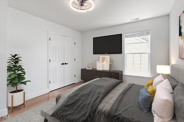 7414 Brandon Allen Ave, Raleigh, NC 27613 - bedroom featuring wood finished floors and a closet