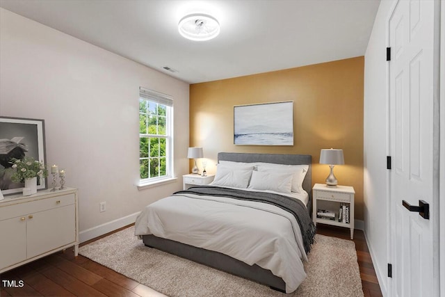 7414 Brandon Allen Ave, Raleigh, NC 27613 - bedroom featuring dark wood finished floors and baseboards