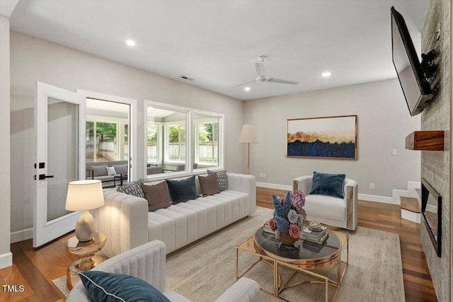 7414 Brandon Allen Ave, Raleigh, NC 27613 - living room featuring recessed lighting, a fireplace, wood finished floors, and a ceiling fan
