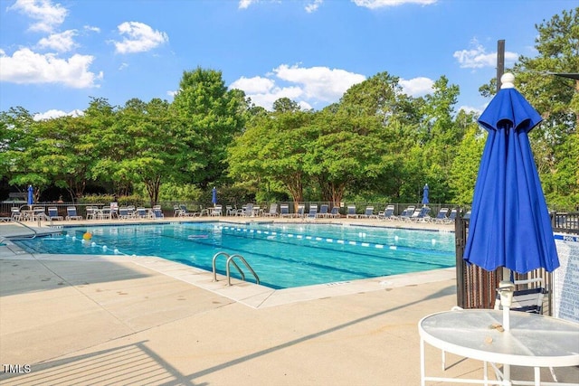7414 Brandon Allen Ave, Raleigh, NC 27613 - community pool with a patio area and view of scattered trees