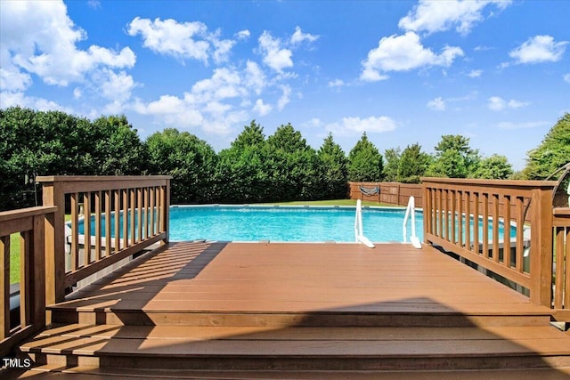 8101 Claybrooke Ct, Willow Springs, NC 27592 - outdoor pool with a wooden deck