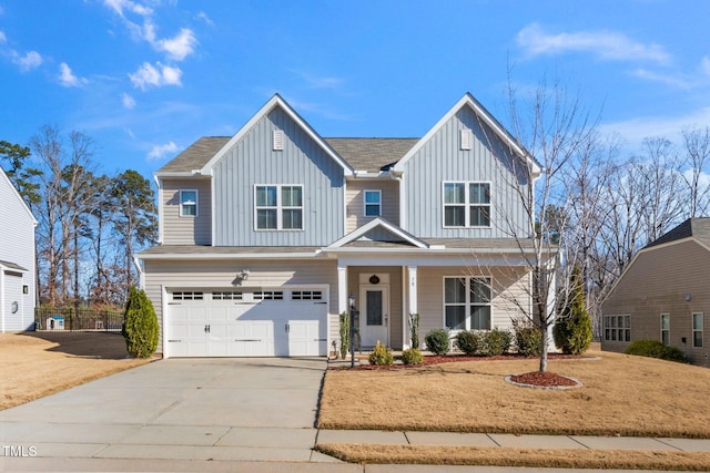 78 N Porcenna Ln, Clayton, NC 27527 - view of front facade with board and batten siding, an attached garage, concrete driveway, and a porch