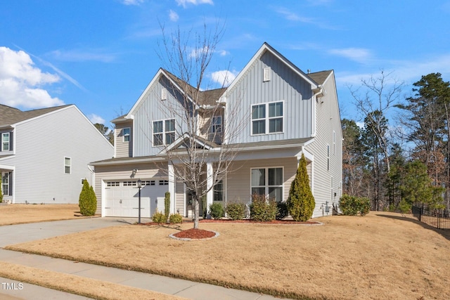 78 N Porcenna Ln, Clayton, NC 27527 - view of front of property featuring board and batten siding, concrete driveway, an attached garage, and a front lawn