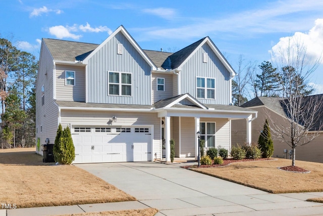 78 N Porcenna Ln, Clayton, NC 27527 - view of front of home with board and batten siding, a garage, covered porch, and driveway