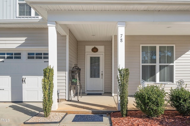 78 N Porcenna Ln, Clayton, NC 27527 - view of exterior entry with a porch and a garage