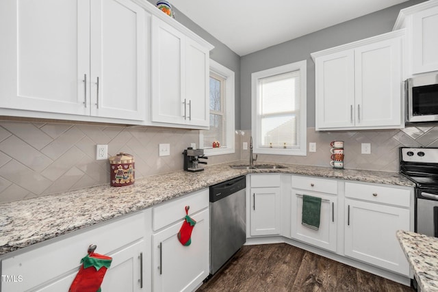 78 N Porcenna Ln, Clayton, NC 27527 - kitchen featuring stainless steel appliances, white cabinets, dark wood finished floors, and backsplash