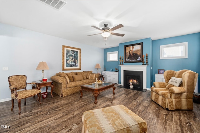 78 N Porcenna Ln, Clayton, NC 27527 - living room with a lit fireplace, a ceiling fan, and wood finished floors