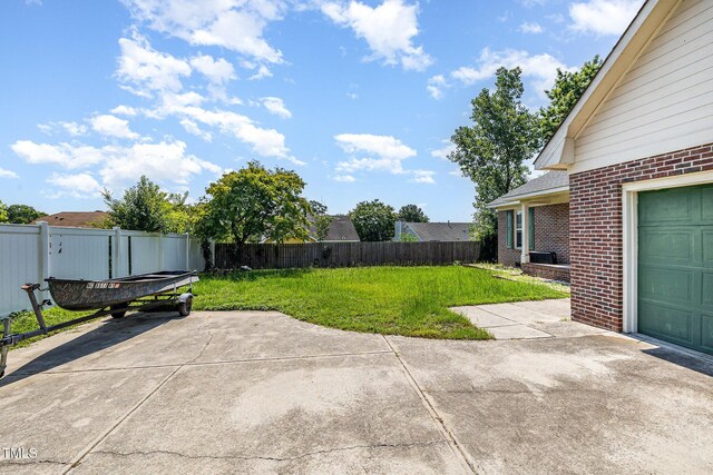 2205 Indigo Bush Pl, Fayetteville, NC 28304 - fenced backyard with a patio area