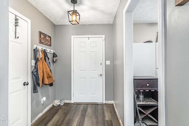 2205 Indigo Bush Pl, Fayetteville, NC 28304 - doorway with dark wood-type flooring and a textured ceiling