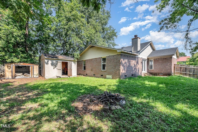 2205 Indigo Bush Pl, Fayetteville, NC 28304 - back of house with crawl space, entry steps, a storage shed, brick siding, and a chimney