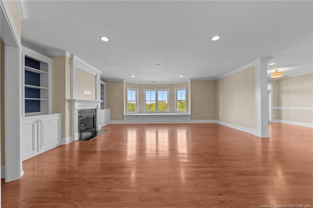 220-404 Hugh Shelton Loop Unit 404, Fayetteville, NC 28301 - unfurnished living room with crown molding, light wood finished floors, a high end fireplace, recessed lighting, and built in features