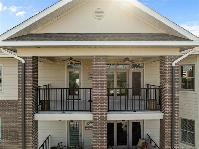 220-404 Hugh Shelton Loop Unit 404, Fayetteville, NC 28301 - back of property featuring a ceiling fan, brick siding, and a balcony