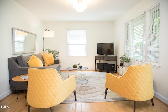 4028 Chaucer Dr, Durham, NC 27705 - living area with plenty of natural light and wood finished floors