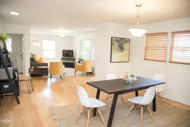 4028 Chaucer Dr, Durham, NC 27705 - dining area with light wood-type flooring and baseboards