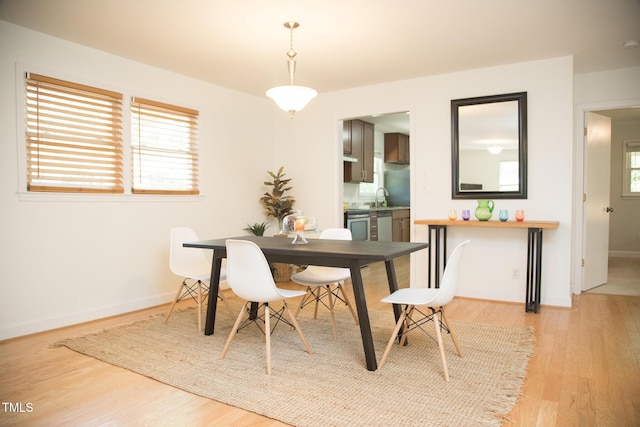 4028 Chaucer Dr, Durham, NC 27705 - dining space with light wood-style floors