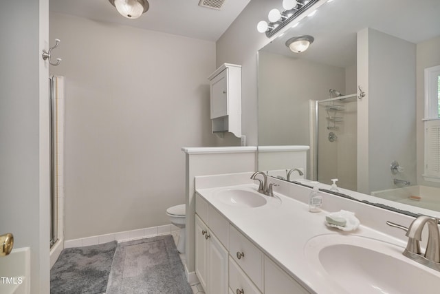 8532 Swarthmore Dr, Raleigh, NC 27615 - full bath featuring an enclosed shower, double vanity, and tile patterned floors