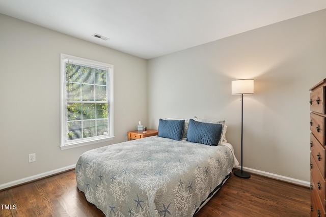 8532 Swarthmore Dr, Raleigh, NC 27615 - bedroom featuring baseboards and wood finished floors
