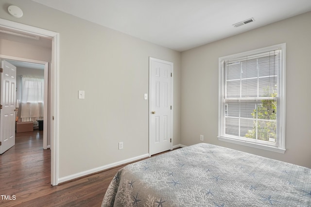 8532 Swarthmore Dr, Raleigh, NC 27615 - bedroom featuring wood finished floors and multiple windows