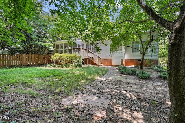 8532 Swarthmore Dr, Raleigh, NC 27615 - view of yard with a sunroom and stairway