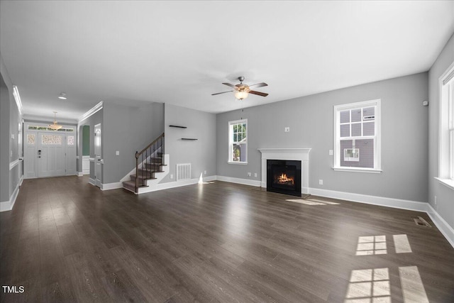 2223 Copper Pond Way, Fuquay Varina, NC 27526 - unfurnished living room featuring ceiling fan, stairway, dark wood-style floors, and a fireplace with flush hearth