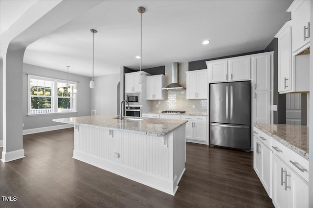 2223 Copper Pond Way, Fuquay Varina, NC 27526 - kitchen with stainless steel appliances, wall chimney exhaust hood, backsplash, white cabinetry, and dark wood-style floors