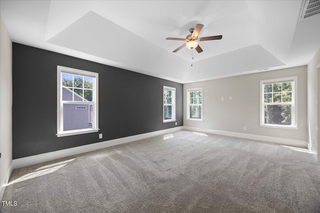 2223 Copper Pond Way, Fuquay Varina, NC 27526 - carpeted empty room featuring a tray ceiling and a ceiling fan