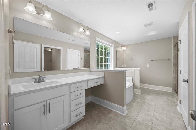 2223 Copper Pond Way, Fuquay Varina, NC 27526 - full bath with vanity, a bath, a shower stall, and tile patterned floors