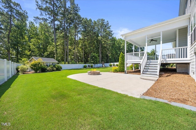 2223 Copper Pond Way, Fuquay Varina, NC 27526 - fenced backyard with a fire pit, a ceiling fan, stairway, and a patio