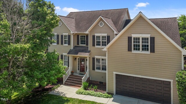 2104 Brockfield Ct, Raleigh, NC 27614 - traditional home featuring a garage and roof with shingles