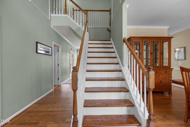 2104 Brockfield Ct, Raleigh, NC 27614 - stairway with crown molding and wood finished floors