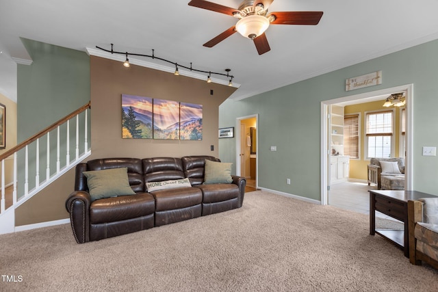 2104 Brockfield Ct, Raleigh, NC 27614 - carpeted living room with ceiling fan, track lighting, stairs, and crown molding