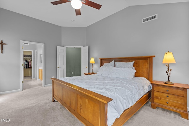2104 Brockfield Ct, Raleigh, NC 27614 - bedroom featuring vaulted ceiling, light carpet, a walk in closet, and a ceiling fan