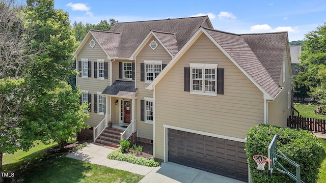 2104 Brockfield Ct, Raleigh, NC 27614 - traditional-style home featuring an attached garage, driveway, and a shingled roof