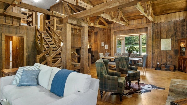 424 Roy Carver Rd, Semora, NC 27343 - living area with wooden walls, wood finished floors, and beamed ceiling