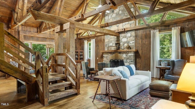 424 Roy Carver Rd, Semora, NC 27343 - living room with a wood ceiling with exposed beams, healthy amount of natural light, wood finished floors, high vaulted ceiling, and wooden walls