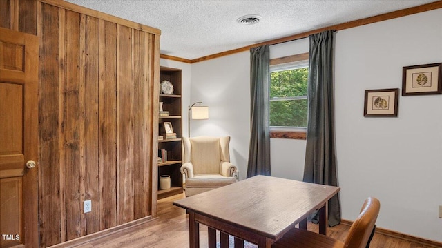 424 Roy Carver Rd, Semora, NC 27343 - office space with light wood-style floors, a textured ceiling, and crown molding