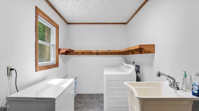 424 Roy Carver Rd, Semora, NC 27343 - laundry area featuring crown molding, washing machine and clothes dryer, and a textured ceiling