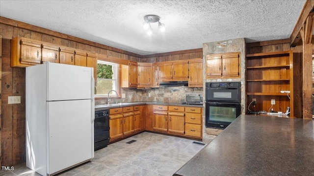 424 Roy Carver Rd, Semora, NC 27343 - kitchen featuring black appliances, wooden walls, dark countertops, brown cabinets, and backsplash
