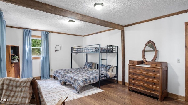 424 Roy Carver Rd, Semora, NC 27343 - bedroom featuring a textured ceiling, wood finished floors, ornamental molding, and beamed ceiling