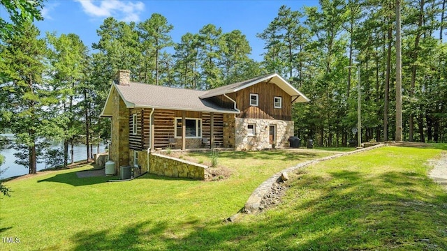 424 Roy Carver Rd, Semora, NC 27343 - log home featuring stone siding, a front yard, a chimney, a water view, and log siding