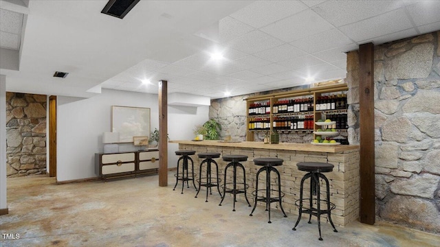 424 Roy Carver Rd, Semora, NC 27343 - indoor bar with a drop ceiling and unfinished concrete flooring