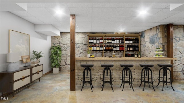 424 Roy Carver Rd, Semora, NC 27343 - indoor bar with concrete flooring and a paneled ceiling