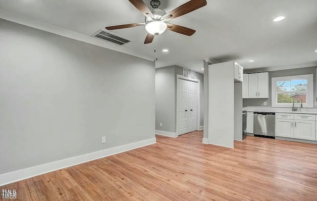 900 Woodrow St S, Wilson, NC 27893 - unfurnished living room with ceiling fan, light wood-style flooring, and recessed lighting