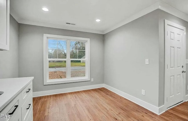 900 Woodrow St S, Wilson, NC 27893 - unfurnished dining area featuring light wood-style flooring and recessed lighting
