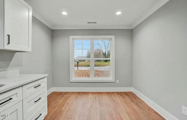 900 Woodrow St S, Wilson, NC 27893 - unfurnished dining area featuring light wood finished floors and recessed lighting