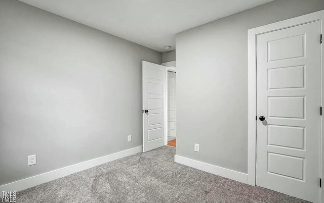 900 Woodrow St S, Wilson, NC 27893 - unfurnished bedroom featuring carpet floors and baseboards
