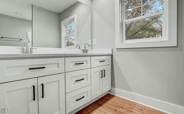 900 Woodrow St S, Wilson, NC 27893 - full bath featuring double vanity and wood finished floors