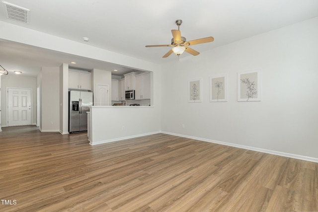 14309 Foxcroft Rd, Raleigh, NC 27614 - unfurnished living room featuring wood finished floors, ceiling fan, and recessed lighting