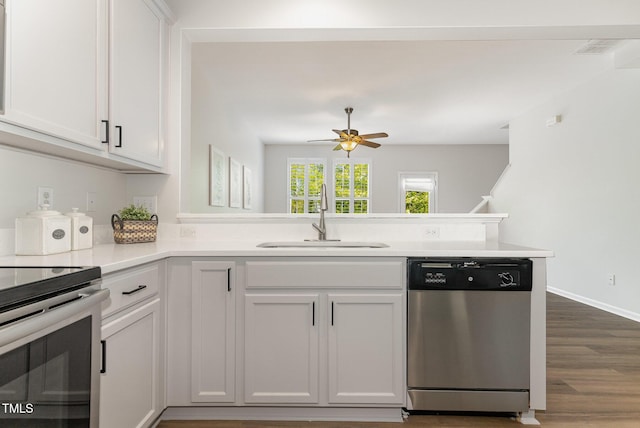 14309 Foxcroft Rd, Raleigh, NC 27614 - kitchen with stainless steel appliances, a peninsula, light countertops, dark wood finished floors, and a ceiling fan