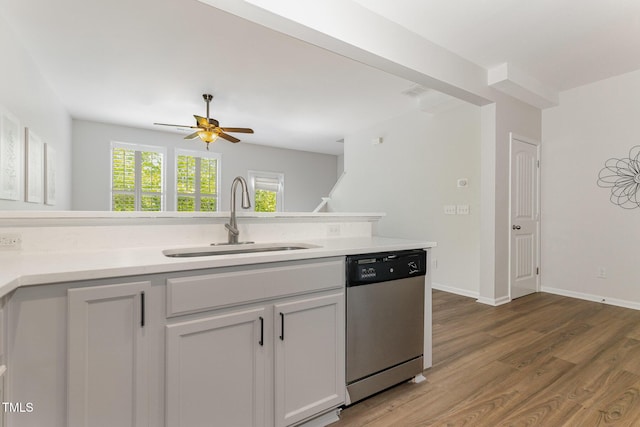 14309 Foxcroft Rd, Raleigh, NC 27614 - kitchen with stainless steel dishwasher, light wood-style flooring, ceiling fan, and light countertops